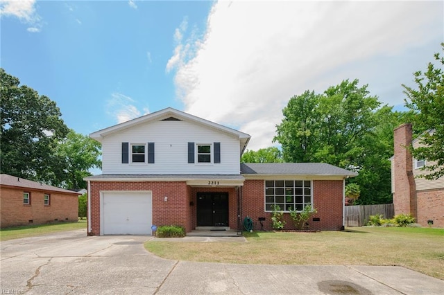 view of front of home with a garage and a front lawn