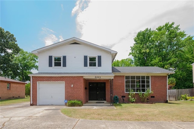 view of front facade with a front yard and a garage