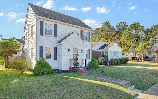 view of front of property with a front lawn