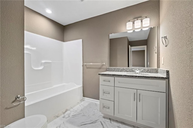 full bathroom with toilet, vanity, and bathing tub / shower combination