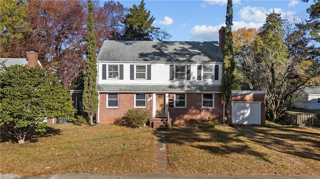 view of front of property featuring a garage and a front lawn