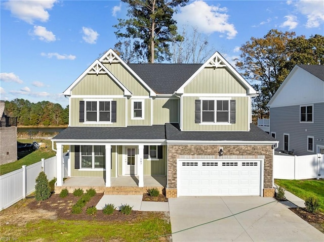 craftsman inspired home featuring a porch and a garage