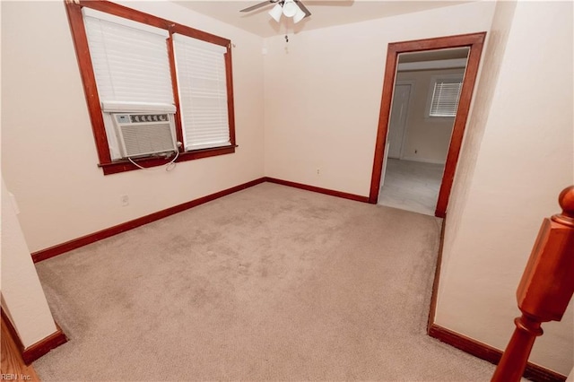 carpeted empty room featuring ceiling fan and cooling unit