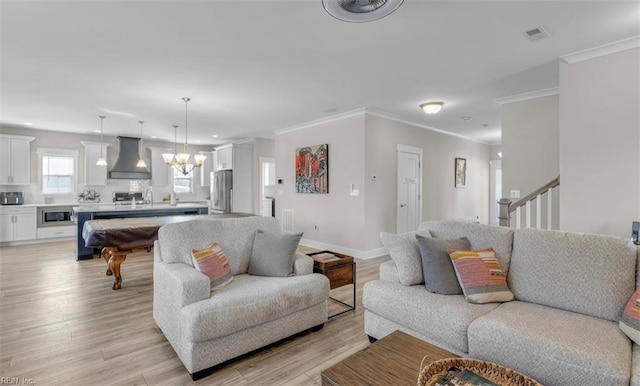 living room featuring ornamental molding, pool table, and light hardwood / wood-style flooring