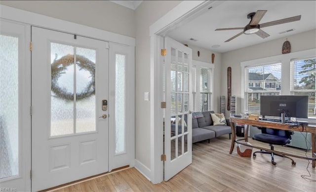 entryway featuring ceiling fan, a healthy amount of sunlight, and light hardwood / wood-style flooring