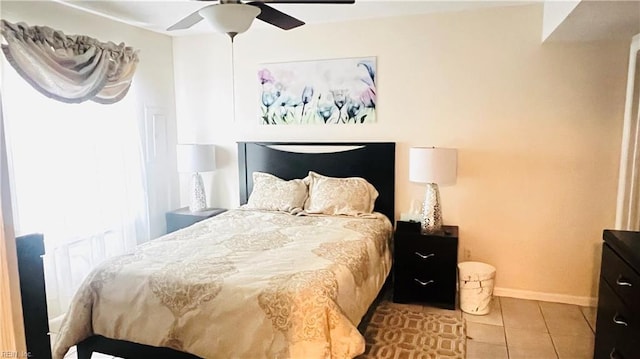 tiled bedroom with ceiling fan