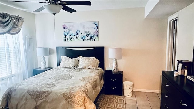 bedroom featuring ceiling fan and light tile patterned floors