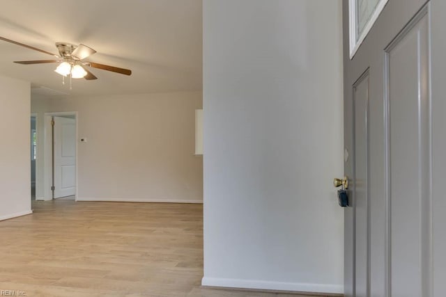 spare room featuring ceiling fan and light hardwood / wood-style flooring