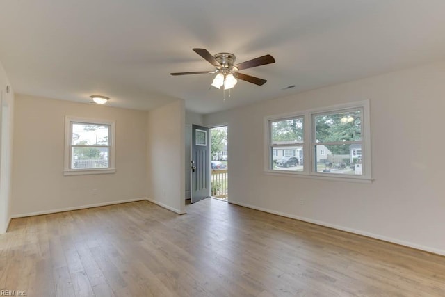 empty room with ceiling fan and light wood-type flooring