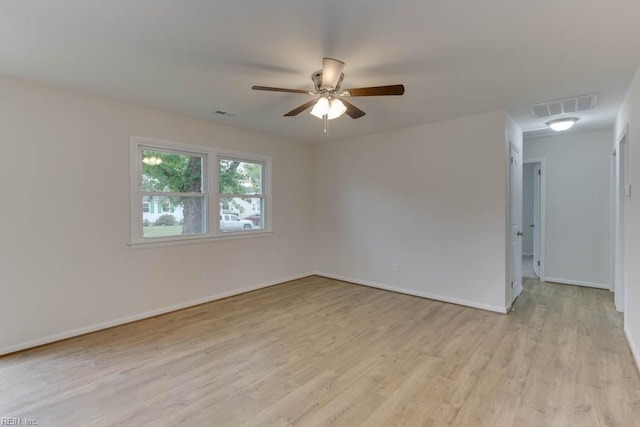 spare room featuring ceiling fan and light wood-type flooring