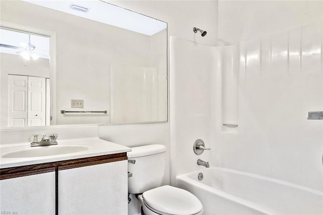 full bathroom with ceiling fan, vanity, shower / bathtub combination, and toilet