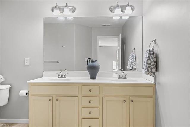 bathroom with vanity and toilet