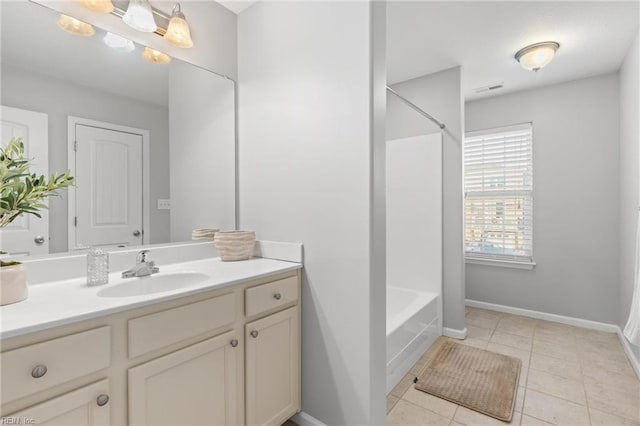 bathroom with tile patterned flooring and vanity