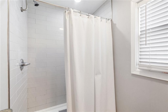 bathroom featuring curtained shower