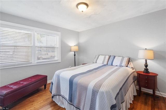 bedroom with hardwood / wood-style floors