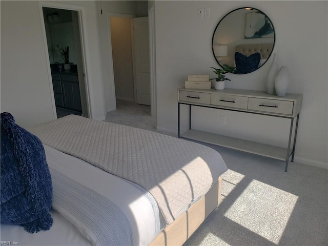 bedroom featuring light colored carpet