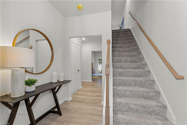 staircase featuring hardwood / wood-style flooring