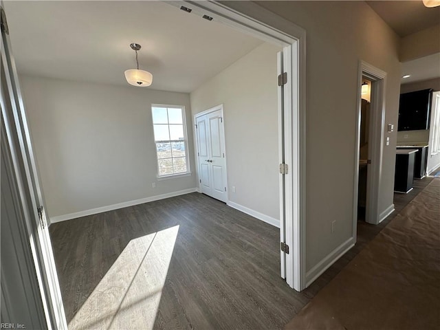 interior space with dark hardwood / wood-style floors