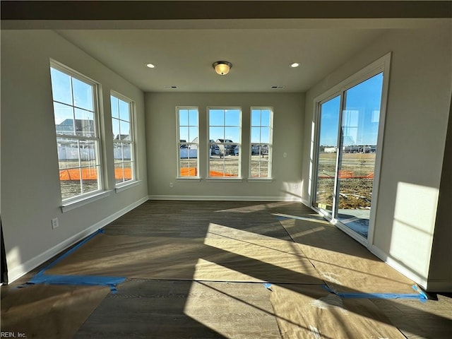 unfurnished sunroom with plenty of natural light