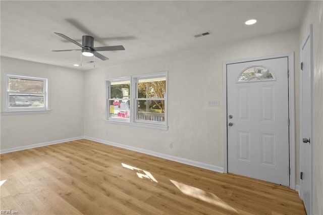 foyer featuring ceiling fan and light wood-type flooring