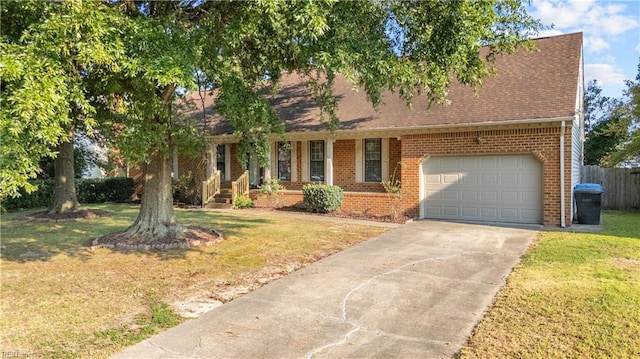 view of front of home featuring a garage and a front lawn