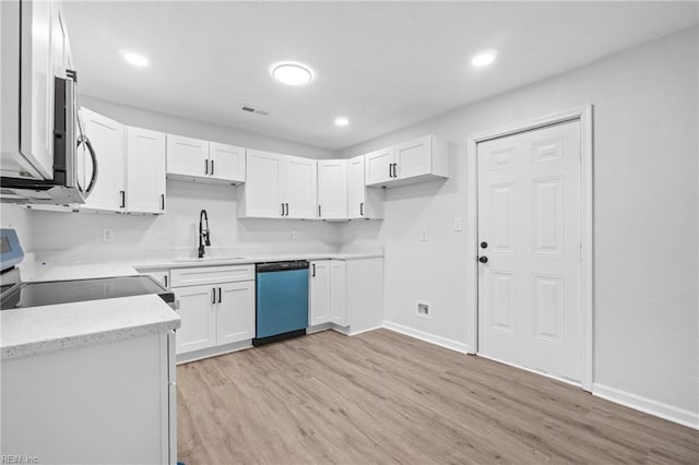 kitchen featuring stove, white cabinets, sink, light hardwood / wood-style flooring, and dishwasher