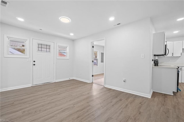 entrance foyer with light hardwood / wood-style flooring