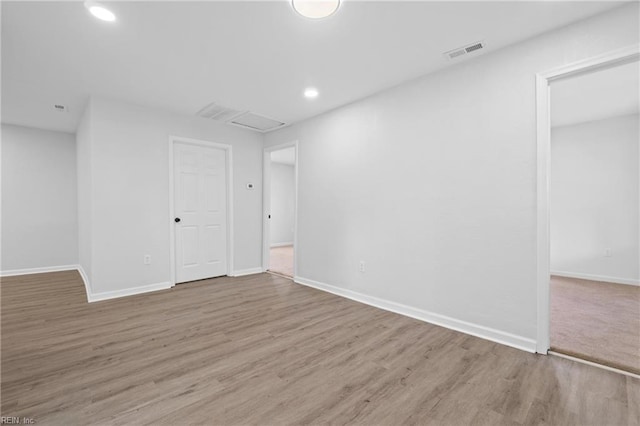 spare room featuring light wood-type flooring