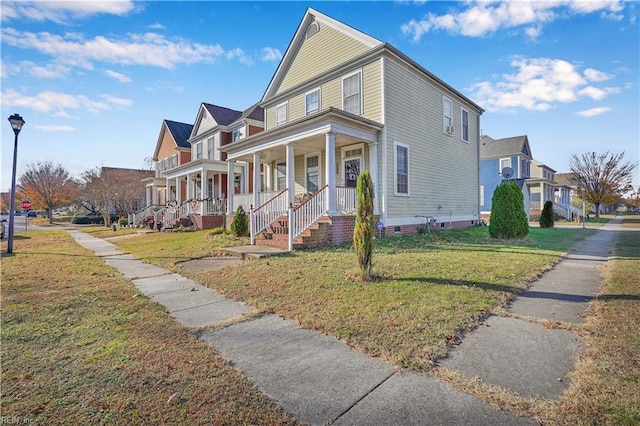 view of front of house with a porch and a front lawn