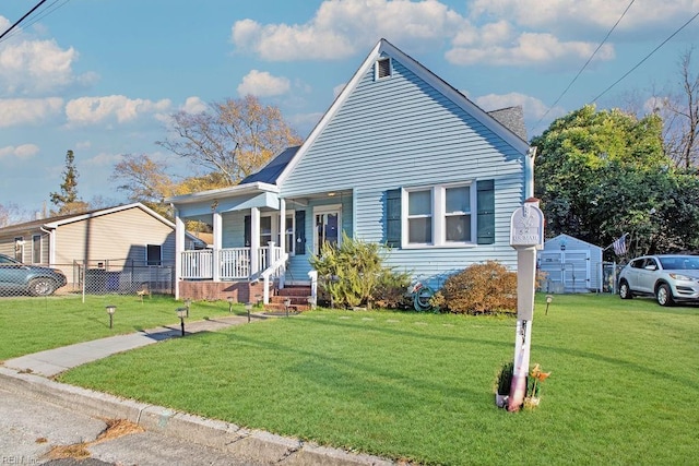 bungalow featuring covered porch and a front lawn