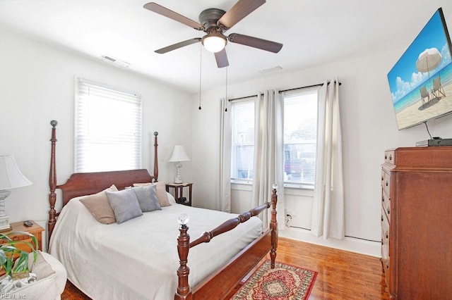 bedroom with light hardwood / wood-style flooring and ceiling fan