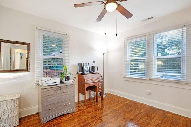 home office featuring hardwood / wood-style floors and ceiling fan