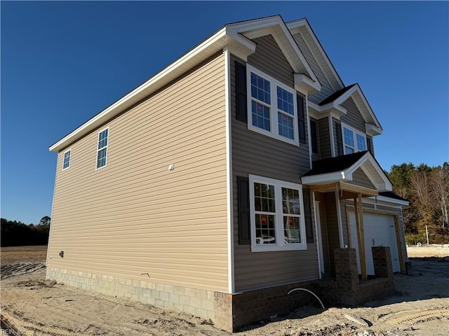 view of property exterior with a garage