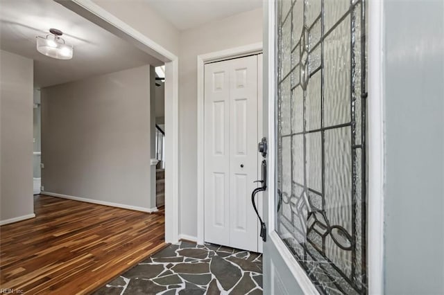 foyer entrance featuring dark hardwood / wood-style flooring