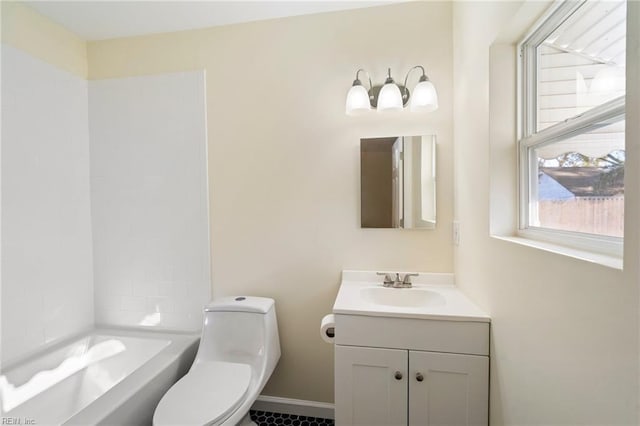 bathroom with vanity, toilet, and a bath