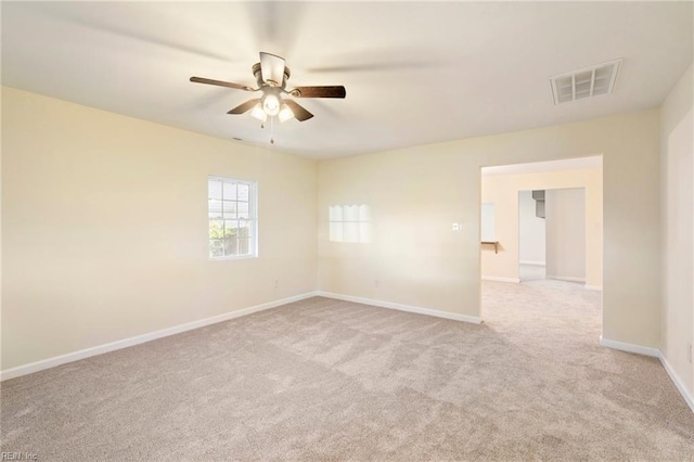 empty room with light carpet and ceiling fan