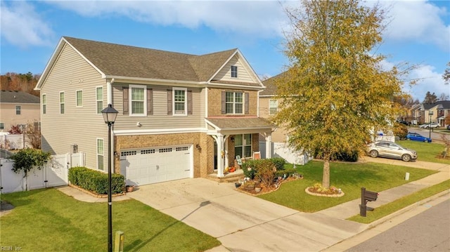 view of front of property featuring a front lawn and a garage