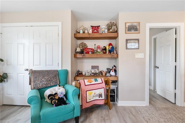 sitting room with light hardwood / wood-style floors