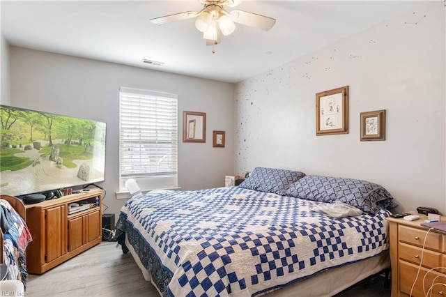 bedroom featuring ceiling fan and light wood-type flooring