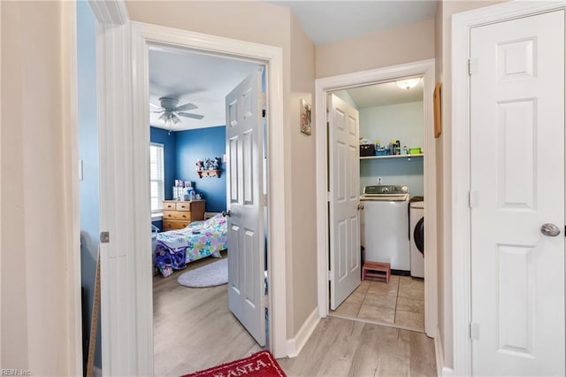 hall featuring light wood-type flooring and washer / clothes dryer