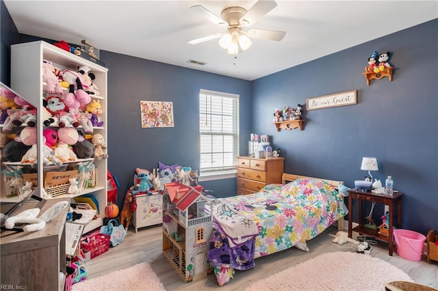 bedroom featuring light hardwood / wood-style flooring and ceiling fan