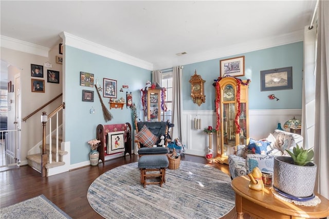 sitting room featuring ornamental molding and dark wood-type flooring