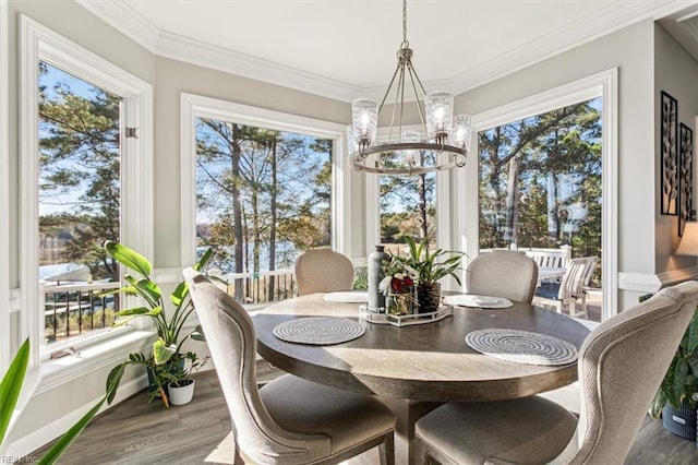 sunroom / solarium with an inviting chandelier