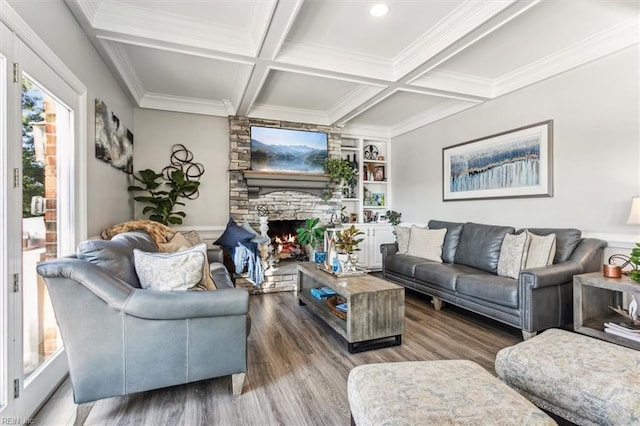 living room featuring coffered ceiling, crown molding, a fireplace, beam ceiling, and wood-type flooring