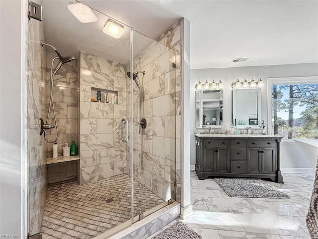 bathroom featuring vanity and an enclosed shower