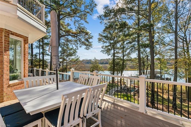 wooden deck featuring a water view