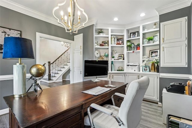 office space with light hardwood / wood-style flooring, a notable chandelier, and crown molding