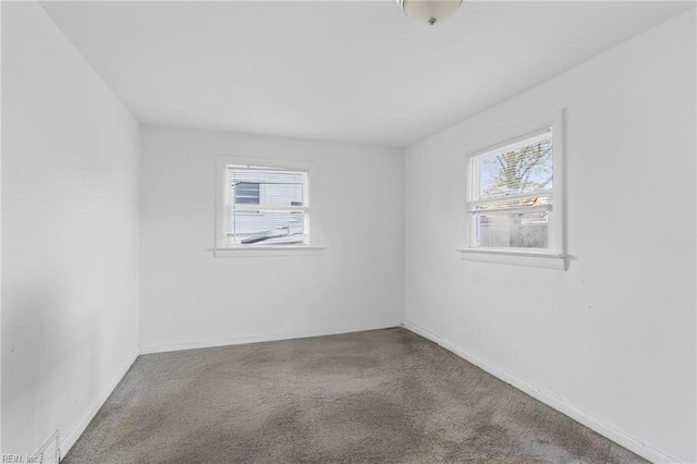 unfurnished room with carpet flooring