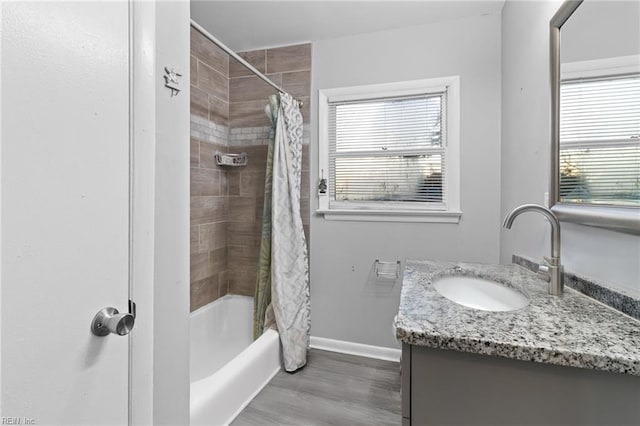 bathroom with vanity, shower / bath combination with curtain, and hardwood / wood-style flooring