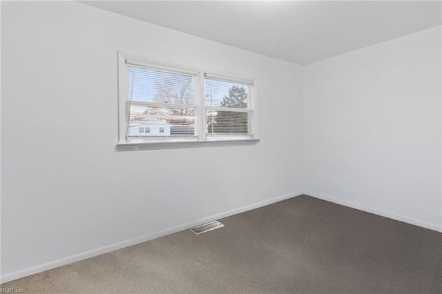 unfurnished room featuring carpet flooring